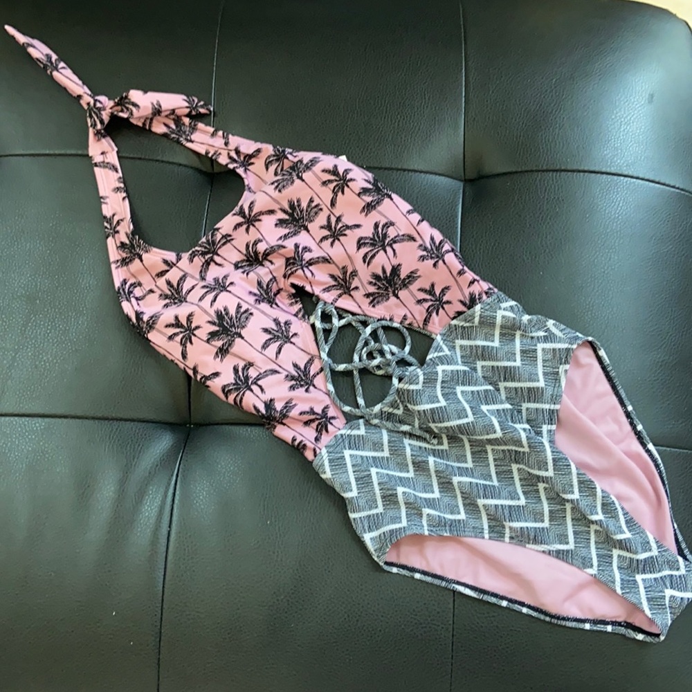 One piece cut out swimsuit. Never used. With tag!